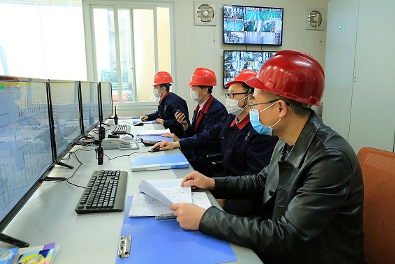 Production control room team monitoring the plant